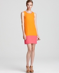 A neon pink dipped hem exudes colorful contrast against a melon-hued shift dress from ERIN Erin Fetherston. A neon pink dipped hem exudes colorful contrast against a melon-hued shift dress from ERIN Erin Fetherston.