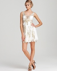 Sparkling beads lend gilded luxury to Sue Wong's swingy frock, boasting airy strips of chiffon at the skirt. Sparkling beads lend gilded luxury to Sue Wong's swingy frock, boasting airy strips of chiffon at the skirt.