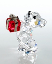 Pronounce staggering emotion to someone special with this adorable gift-toting bear. Designed by Peter Heidegger for Swarovski, this lovable fellow is crafted of fully faceted clear crystal with Jet-crystal eyes and nose and a Light Siam crystal present. The perfect gift for birthdays, holidays or an extra sweet thank-you. Meaures 1.5 x .75. Swarovski logo on bottom right foot. Pronounce staggering emotion to someone special with this adorable gift-toting bear. Designed by Peter Heidegger for Swarovski, this lovable fellow is crafted of fully faceted clear crystal with Jet-crystal eyes and nose and a Light Siam crystal present. The perfect gift for birthdays, holidays or an extra sweet thank-you. Meaures 1.5 x .75. Swarovski logo on bottom right foot.