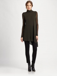 Sultry, sheer sleeves and a fashion-forward asymmetrical hem give this mesh tunic an intriguing look.TurtleneckSheer sleevesPull-on styleAsymmetrical hemAbout 32 from shoulder to hemPolyamideDry cleanMade in Italy Model shown is 5'11 (180cm) wearing US size Small. Sultry, sheer sleeves and a fashion-forward asymmetrical hem give this mesh tunic an intriguing look.TurtleneckSheer sleevesPull-on styleAsymmetrical hemAbout 32 from shoulder to hemPolyamideDry cleanMade in Italy Model shown is 5'11 (180cm) wearing US size Small.