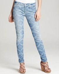 These 7 For All Mankind skinny jeans are enlivened by a faded ikat print and finished with a casually cool roll-up hem. These 7 For All Mankind skinny jeans are enlivened by a faded ikat print and finished with a casually cool roll-up hem.