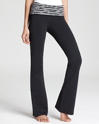 With a printed foldover waistband and a bootcut leg that works with sneakers or bare feet, these workout pants move with you from the treadmill to the yoga mat. With a printed foldover waistband and a bootcut leg that works with sneakers or bare feet, these workout pants move with you from the treadmill to the yoga mat.
