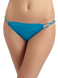 THE LOOKBraided side straps with silvery bead and disc accentsElastic waist and leg openingsTHE MATERIAL85% Meryl nylon/15% spandexFully linedCARE & ORIGINHand washImportedPlease note: Bikini top sold separately. THE LOOKBraided side straps with silvery bead and disc accentsElastic waist and leg openingsTHE MATERIAL85% Meryl nylon/15% spandexFully linedCARE & ORIGINHand washImportedPlease note: Bikini top sold separately.