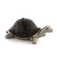 Inspired by a traditional fairy tale, this tortoise bank is a nostalgic reminder of the innocence of childhood, celebrating fantasy, fable and whimsicality. Inspired by a traditional fairy tale, this tortoise bank is a nostalgic reminder of the innocence of childhood, celebrating fantasy, fable and whimsicality.