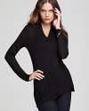 Lined with a seamless lockstitched shapewear tank to slim the figure, this Miraclebody by Miraclesuit tunic lends itself to effortless layering with a chic, understated silhouette.