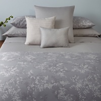 A color coordinated bedskirt in textured cotton complements the Lilacs collection.