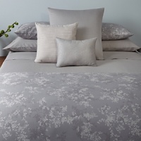 A color coordinated bedskirt in textured cotton complements the Lilacs collection. A color coordinated bedskirt in textured cotton complements the Lilacs collection.