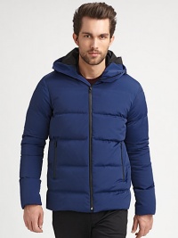 A sleek quilted design is enhanced by a smooth finish featuring an attached hood for added warmth and style.Zip frontStand collarAttached hoodSide zip pocketsAbout 29 from shoulder to hemPolyesterDry cleanImported