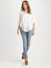 Utter romance in this light and flowy peasant blouse styled with soft ruffles and eyelet trim.Tie-front split V-neckDropped shouldersThree-quarter sleevesGathered bodiceShirttail hemRayonDry cleanImportedModel shown is 5'8½ (174cm) wearing US size Small. Utter romance in this light and flowy peasant blouse styled with soft ruffles and eyelet trim.Tie-front split V-neckDropped shouldersThree-quarter sleevesGathered bodiceShirttail hemRayonDry cleanImportedModel shown is 5'8½ (174cm) wearing US size Small.