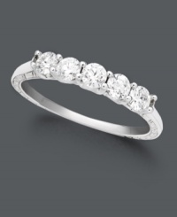 Commemorate the moment with sparkling sophistication. A dazzling wedding band marks the occasion with five round-cut diamonds (1/4 ct. t.w.) in a shining 18k white gold setting. IGI Certified diamonds. Commemorate the moment with sparkling sophistication. A dazzling wedding band marks the occasion with five round-cut diamonds (1/4 ct. t.w.) in a shining 18k white gold setting. IGI Certified diamonds.
