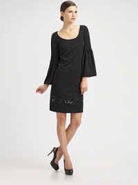 Sparkling Swarovski crystals skirt the hem of this bell-sleeved silhouette.Scoopneck Long bell sleeves Swarovski crystal details at hemline Concealed back zip Fully lined About 22 from natural waist Polyester Dry clean Made in USA of imported fabricModel shown is 5'9 wearing US size 2. Sparkling Swarovski crystals skirt the hem of this bell-sleeved silhouette.Scoopneck Long bell sleeves Swarovski crystal details at hemline Concealed back zip Fully lined About 22 from natural waist Polyester Dry clean Made in USA of imported fabricModel shown is 5'9 wearing US size 2.