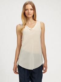 A cool and casual tank that can be dressed up or down.Draped neckSleevelessUnfinished hemAbout 30 from shoulder to hemSilkDry cleanImported A cool and casual tank that can be dressed up or down.Draped neckSleevelessUnfinished hemAbout 30 from shoulder to hemSilkDry cleanImported