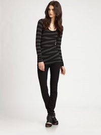 Asymmetrical contrast panels crisscross to create flattering stripes and a trend-forward bandage effect that visually slims the torso. ScoopneckLong sleevesLonger length hits below the hips94% rayon/6% spandexDry cleanMade in USAModel shown is 5'9½ (176cm) wearing US size Small. Asymmetrical contrast panels crisscross to create flattering stripes and a trend-forward bandage effect that visually slims the torso. ScoopneckLong sleevesLonger length hits below the hips94% rayon/6% spandexDry cleanMade in USAModel shown is 5'9½ (176cm) wearing US size Small.