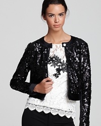 Exquisite in sequins, this Nanette Lepore jacket dazzles with a split collar and silky trim. Exquisite in sequins, this Nanette Lepore jacket dazzles with a split collar and silky trim.