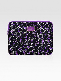A floral printed style in lightweight nylon and soft padded for chic protection.Top zip closureFully lined13W X 10H X 1DImported A floral printed style in lightweight nylon and soft padded for chic protection.Top zip closureFully lined13W X 10H X 1DImported