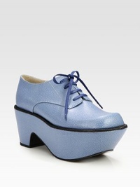 A curved platform defines this retro-inspired, lace-up silhouette of speckled leather with contrast trim. Self-covered heel, 3 (75mm)Covered platform, 2½ (65mm)Compares to a ½ heel (15mm)Leather upperLeather lining and solePadded insoleImported A curved platform defines this retro-inspired, lace-up silhouette of speckled leather with contrast trim. Self-covered heel, 3 (75mm)Covered platform, 2½ (65mm)Compares to a ½ heel (15mm)Leather upperLeather lining and solePadded insoleImported