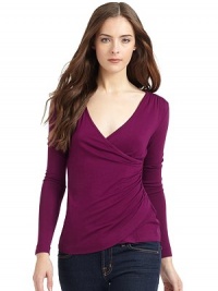 THE LOOKCrossover v-neckLong sleevesGathered shouldersGathered sideTulip hemTHE FITAbout 23 from shoulder to hemTHE MATERIAL95% viscose/5% spandexCARE & ORIGINMachine washImportedModel shown is 5'9½ (176cm) wearing US size Small.9 Months 
