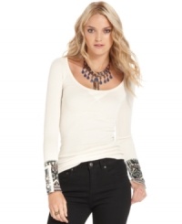 The traditional thermal gets a stylish spin with this Free People top featuring printed cuffs with studs and buttons! The traditional thermal gets a stylish spin with this Free People top featuring printed cuffs with studs and buttons!