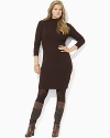 Rendered in luxurious merino wool, a ribbed, form-fitting mockneck dress exudes timeless sophistication.