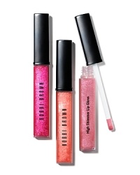 Bobbi's new lip gloss combines gorgeous, light-catching shimmer with lasting, non-sticky shine. Made with fine pearls and clear pigments, High Shimmer Lip Gloss stays color-true and gives lips beautiful, brilliant dimension. Plus it's enriched with emollients and Vitamins C and E to moisturize, condition and protect lips, so they feel as good as they look. Whether you wear it on its own or on top of your favorite Lip Color, the new tapered applicator lets you apply it like a pro. Bobbi's new lip gloss combines gorgeous, light-catching shimmer with lasting, non-sticky shine. Made with fine pearls and clear pigments, High Shimmer Lip Gloss stays color-true and gives lips beautiful, brilliant dimension. Plus it's enriched with emollients and Vitamins C and E to moisturize, condition and protect lips, so they feel as good as they look. Whether you wear it on its own or on top of your favorite Lip Color, the new tapered applicator lets you apply it like a pro.