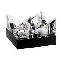 These four architectural votives can be arranged in intriguing combinations that will reflect off the tray in different ways each time. These four architectural votives can be arranged in intriguing combinations that will reflect off the tray in different ways each time.