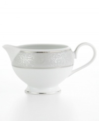 Clean, cool and marked by an understated elegance, this creamer features a soft gray border embellished by an intricate scroll design to gracefully sweeten any occasion. From Mikasa's dinnerware and dishes collection. Clean, cool and marked by an understated elegance, this creamer features a soft gray border embellished by an intricate scroll design to gracefully sweeten any occasion. From Mikasa's dinnerware and dishes collection.