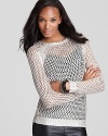 Add shimmer to your off-duty wardrobe with this Velvet by Graham & Spencer sweater, rendered in a metallic open knit.