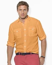 Cut for a comfortable, classic fit, a versatile roll-sleeve sport shirt is crafted from soft, washed linen with military-inspired details. Cut for a comfortable, classic fit, a versatile roll-sleeve sport shirt is crafted from soft, washed linen with military-inspired details.