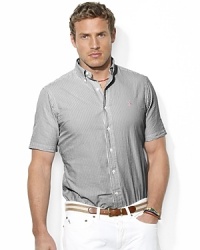 The embodiment of preppy heritage, a classic-fitting shirt is rendered in light-as-air seersucker cotton with sleek stripes for a casual warm-weather look. The embodiment of preppy heritage, a classic-fitting shirt is rendered in light-as-air seersucker cotton with sleek stripes for a casual warm-weather look.