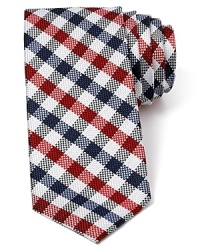A nostalgic multi-tone check pattern features a narrower width for a modern silhouette and is crafted in plush silk. A nostalgic multi-tone check pattern features a narrower width for a modern silhouette and is crafted in plush silk.