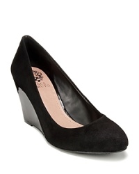 These understated, stylish VINCE CAMUTO wedge pumps are sure to stay in heavy shoe wardrobe rotation. These understated, stylish VINCE CAMUTO wedge pumps are sure to stay in heavy shoe wardrobe rotation.