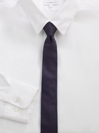 A simplistic design woven in smooth Italian silk.About 2 wideSilkDry cleanMade in Italy