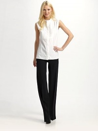 Utterly versatile sleeveless style with a precisely pintucked bib front.Stand collar Pleated shoulders Pintucked bib front Sleeveless Concealed button front Uneven hem About 21½ from shoulder to hem 80% cotton/16% nylon/4% other fibers Dry clean Made in Italy Utterly versatile sleeveless style with a precisely pintucked bib front.Stand collar Pleated shoulders Pintucked bib front Sleeveless Concealed button front Uneven hem About 21½ from shoulder to hem 80% cotton/16% nylon/4% other fibers Dry clean Made in Italy