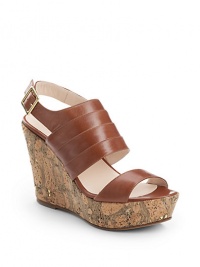 THE LOOKOpen toeSmooth leather atop a cork wedge with golden touchesSeamed detailing on topAdjustable back strapPadded insoleTHE FITCork-covered wedge 4 (100mm)Cork-covered platform, 1 (25mm)Compares to a 3 heel (75mm)THE MATERIALLeather upperLeather lining and soleORIGINMade in Italy THE LOOKOpen toeSmooth leather atop a cork wedge with golden touchesSeamed detailing on topAdjustable back strapPadded insoleTHE FITCork-covered wedge 4 (100mm)Cork-covered platform, 1 (25mm)Compares to a 3 heel (75mm)THE MATERIALLeather upperLeather lining and soleORIGINMade in Italy