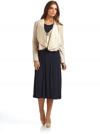 THE LOOKSilk dropped lapelLamb skin self tie at frontLong sleevesTHE FITAbout 19.5 from shoulder to hemTHE MATERIALLamb skinTrim: silkFully linedCARE & ORIGINDry cleanMade in Italy THE LOOKSilk dropped lapelLamb skin self tie at frontLong sleevesTHE FITAbout 19.5 from shoulder to hemTHE MATERIALLamb skinTrim: silkFully linedCARE & ORIGINDry cleanMade in Italy