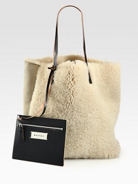Super-soft and so luxurious, this shearling style comes with a detachable coin pouch for easy access to your smaller essentials.Double leather shoulder straps, 10 dropOpen topDetachable coin pouch13W X 15¾H X 6DMade in Italy Super-soft and so luxurious, this shearling style comes with a detachable coin pouch for easy access to your smaller essentials.Double leather shoulder straps, 10 dropOpen topDetachable coin pouch13W X 15¾H X 6DMade in Italy