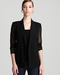The Aqua blazer goes glamorous with sheer elements for day-to-night cool. The Aqua blazer goes glamorous with sheer elements for day-to-night cool.