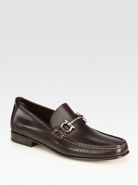 Timeless slip-on articulated in sleek calfskin with iconic gancini ornament.Calfskin upperLeather liningPadded insoleLeather soleMade in Italy Timeless slip-on articulated in sleek calfskin with iconic gancini ornament.Calfskin upperLeather liningPadded insoleLeather soleMade in Italy