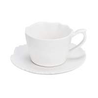 An organically scalloped, off-white dinnerware pattern that contributes elements of both texture and design to your dining experience.