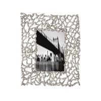 Organically molded under fire, this handmade frame exudes metal artistry with a New York edge. Organically molded under fire, this handmade frame exudes metal artistry with a New York edge.