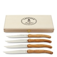 Crafted in France, these chic and practical Laguiole knives feature olive wood handles and safely store in a closing wood box.