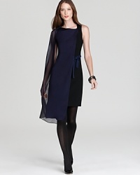 Embrace this season's flair for the dramatic in a stunning Elie Tahari dress, flaunting a sheer cape overlay and fitted sheath silhouette for serious fashion presence. Embrace this season's flair for the dramatic in a stunning Elie Tahari dress, flaunting a sheer cape overlay and fitted sheath silhouette for serious fashion presence.
