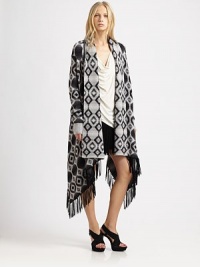 The perfect layering piece, with a vintage-inspired geometric print rendered in cozy wool. Shawl collarDropped shouldersLong sleeves with ribbed cuffsOpen frontFringe trimAsymmetrical hemAbout 46 from shoulder to hemMerino woolDry cleanImportedModel shown is 5'11 (180cm) wearing US size X-Small/Small. The perfect layering piece, with a vintage-inspired geometric print rendered in cozy wool. Shawl collarDropped shouldersLong sleeves with ribbed cuffsOpen frontFringe trimAsymmetrical hemAbout 46 from shoulder to hemMerino woolDry cleanImportedModel shown is 5'11 (180cm) wearing US size X-Small/Small.