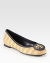 Finished with contrasting leather trim, this woven raffia flat has a rubber sole and signature designer emblem. Raffia and leather upperLeather liningRubber solePadded insoleImportedOUR FIT MODEL RECOMMENDS ordering true size. 