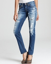Serious distressing toughens up these True Religion boyfriend jeans, rendered in a subtly slouchy fit for a tomboy-inspired spin.