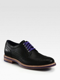 Sharp detailing, contrasting colors and allover perforations makes this sleek oxford design one step ahead of the rest.Leather upperLeather liningPadded insoleRubber soleImported Sharp detailing, contrasting colors and allover perforations makes this sleek oxford design one step ahead of the rest.Leather upperLeather liningPadded insoleRubber soleImported