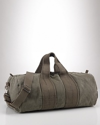 A heavy-duty, barrel-style canvas duffel is the perfect go-anywhere bag with its ability to stand up to the elements and maintain vintage style. A heavy-duty, barrel-style canvas duffel is the perfect go-anywhere bag with its ability to stand up to the elements and maintain vintage style.