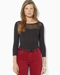 An elegant modal jersey shirt features a graceful bateau neckline and a beaded mesh panel for stylish shimmer. An elegant modal jersey shirt features a graceful bateau neckline and a beaded mesh panel for stylish shimmer.