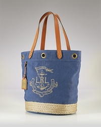 Lauren Ralph Lauren is on board with daytime demands. This nautically-inspired tote boasts a straw trimmed design, sturdy leather trims and shoulder-right shape. Lauren Ralph Lauren is on board with daytime demands. This nautically-inspired tote boasts a straw trimmed design, sturdy leather trims and shoulder-right shape.