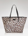 This perennially polished kate spade new york carryall gets a major dose of the label's whimsical style, crafted of nylon with glossy leather trims.